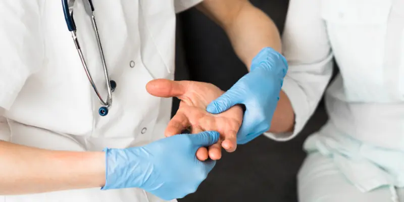 A Doctor Is Checking The Hand Of A Disbetic Person For Diabetic Neuropathy A doctor is checking the hand of a diabetic person for diabetic neuropathy