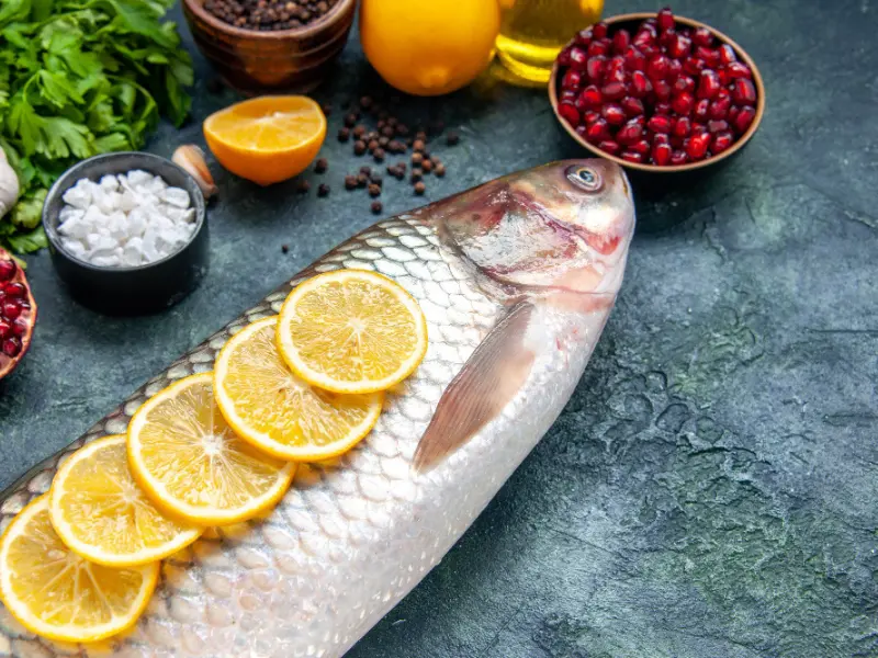 Omega 3 rich foods including salmon fish, lemon